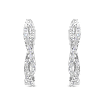 Front-facing view of white metal earrings with twisting design featuring rows of round and baguette-shaped white gemstones in prong and channel settings.