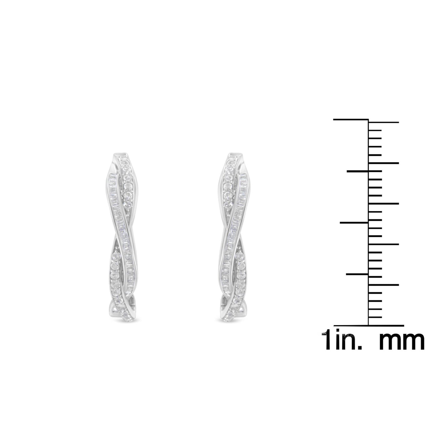 Front view of white metal earrings with two intertwined rows of white round prong-set and white baguette channel-set gemstones, shown next to a ruler for size reference.