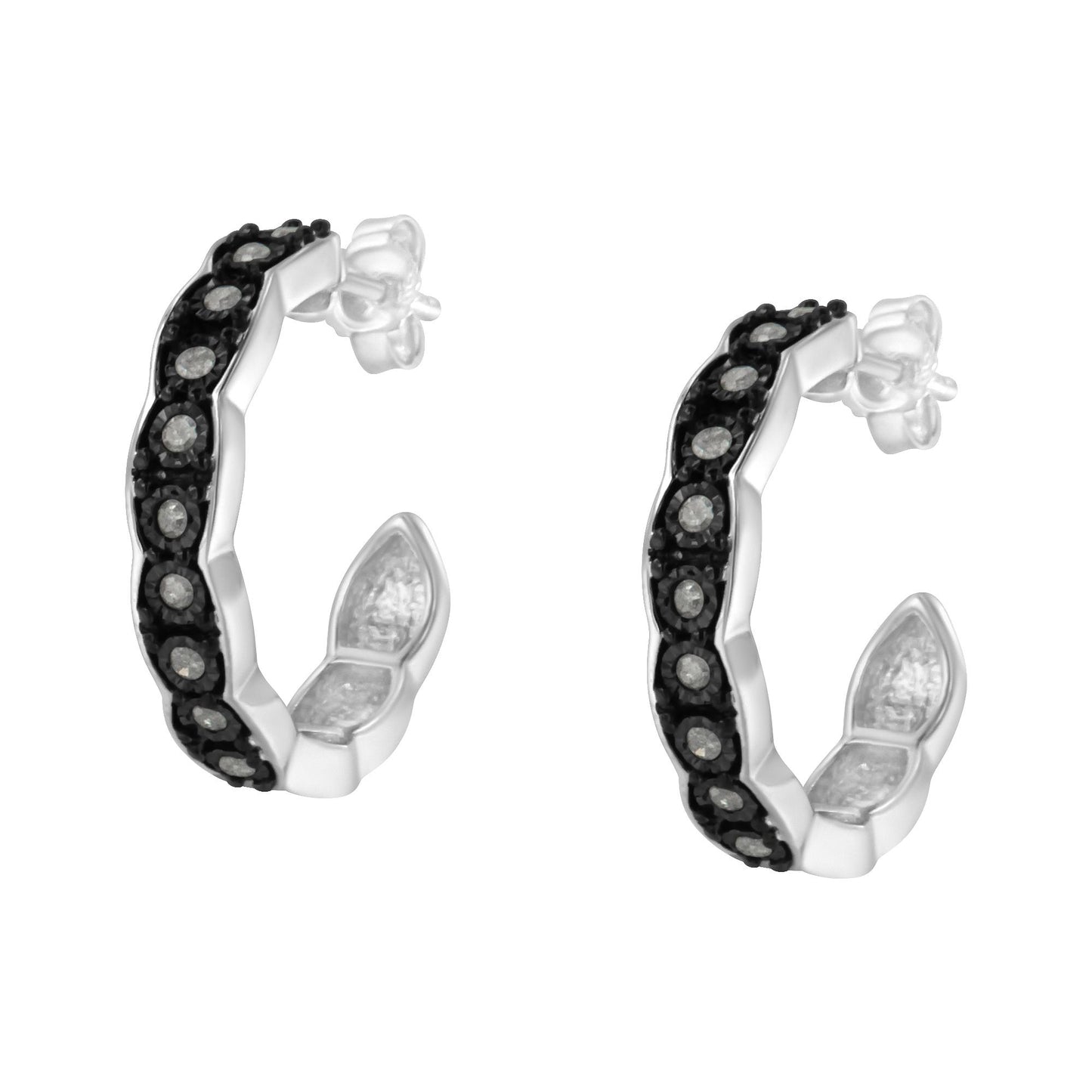 Pair of two-toned hoop earrings with round white gemstones in a miracle setting, shown at a slight angle.