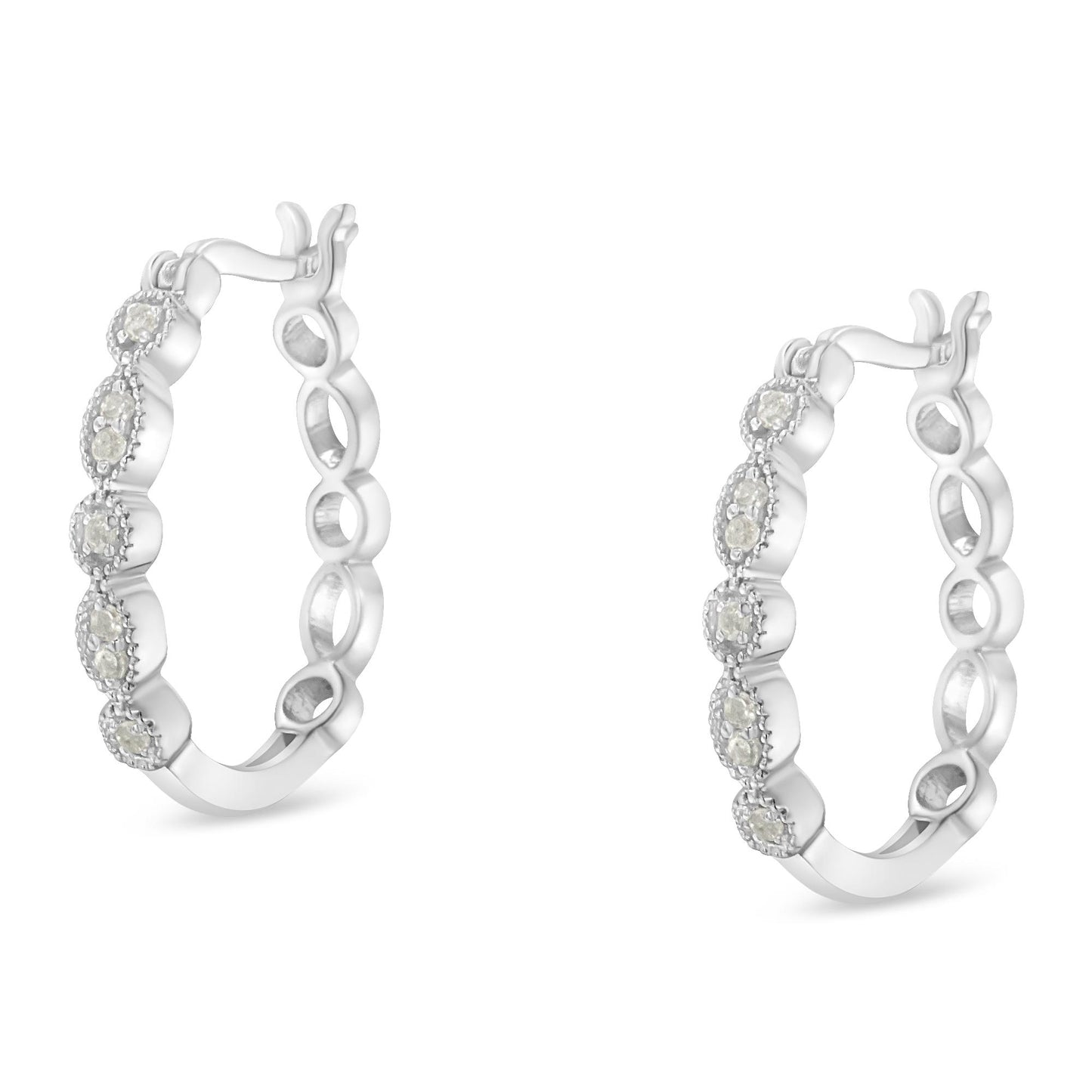Pair of white metal hoop earrings with round white gemstones set in prong settings, shown from a front angle on a white background.