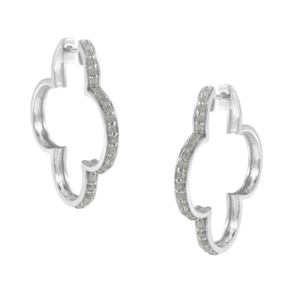 Pair of white metal earrings with a rounded quatrefoil shape, adorned with prong-set white round gemstones, shown from a front angle.