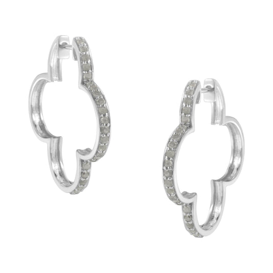 Pair of white metal earrings with a rounded quatrefoil shape, adorned with prong-set white round gemstones, shown from a front angle.