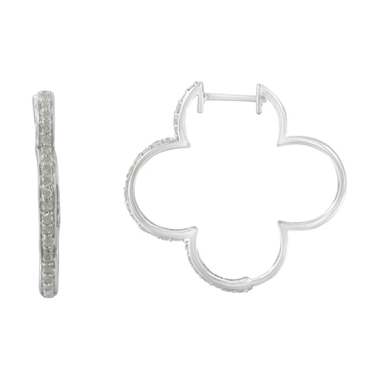Pair of white metal earrings with a clover-like shape, each adorned with round white gemstones in prong settings, shown from side and front angles.