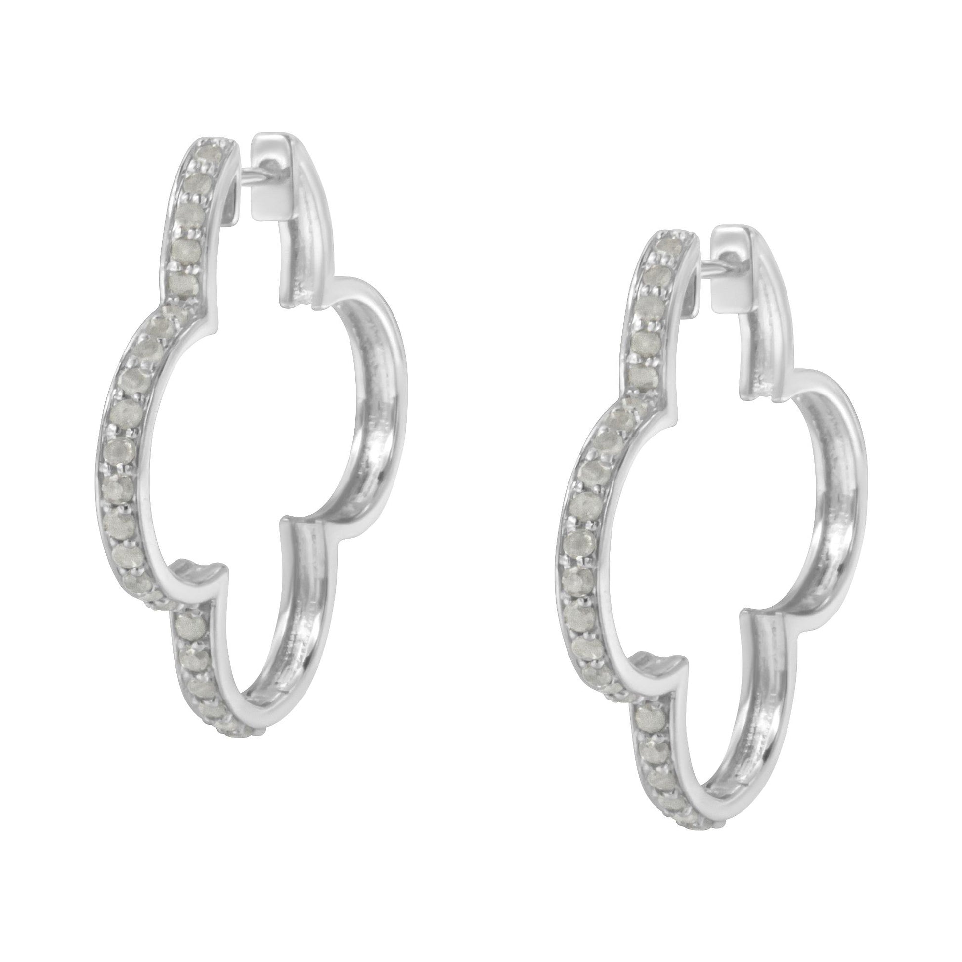 Front angled view of white metal earrings in a quatrefoil hoop shape with round white gemstones set in prongs along the outer edges.