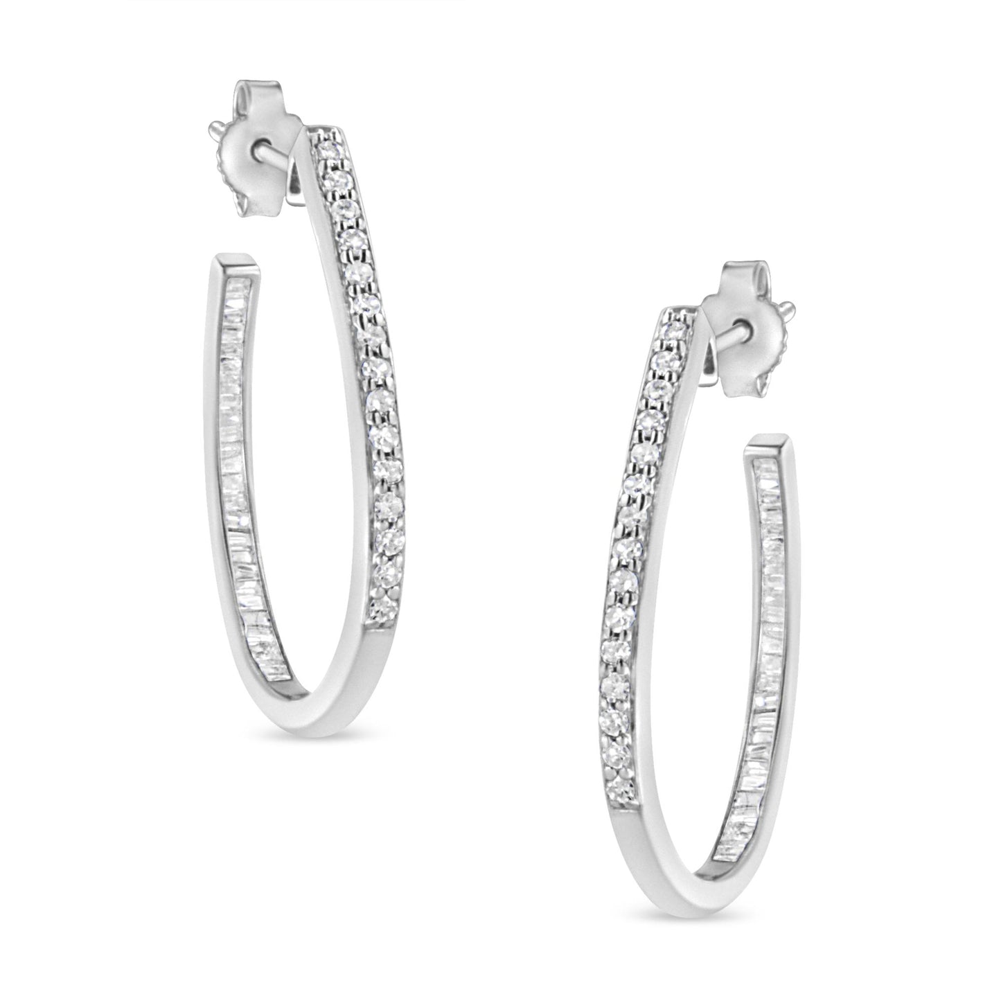 Pair of white metal hoop earrings with round prong-set white gemstones on the outer edge and baguette channel-set white gemstones on the inner edge, shown in a front angled view.