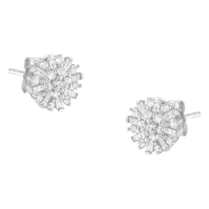 Pair of white metal stud earrings with round and baguette white gemstones, viewed from a slight side angle.