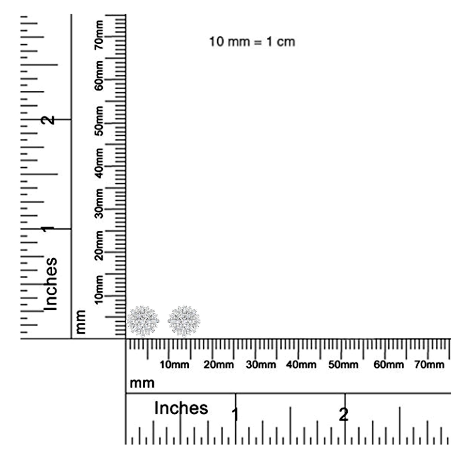 White metal earrings with round and baguette-shaped white gemstones in prong and invisible settings, shown at an angle on a ruler for size reference.