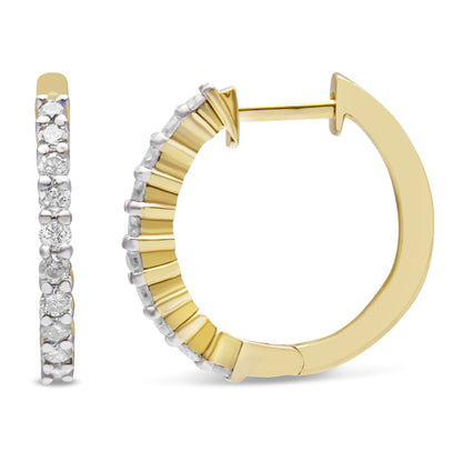 Close-up front and side view of yellow hoop earrings with prong-set round white gemstones along the outer edge.