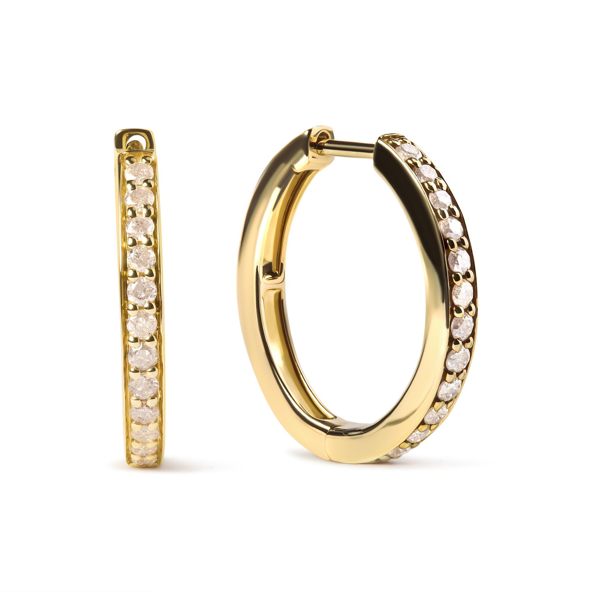 Pair of yellow metal hoop earrings with round white gemstones in prong settings, shown from front and angled side views.