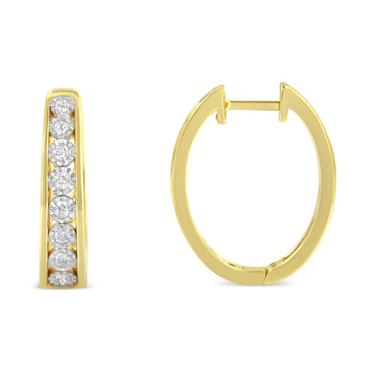 Front and side view of two-toned hoop earrings with round white gemstones set in a row, shown against a white background.