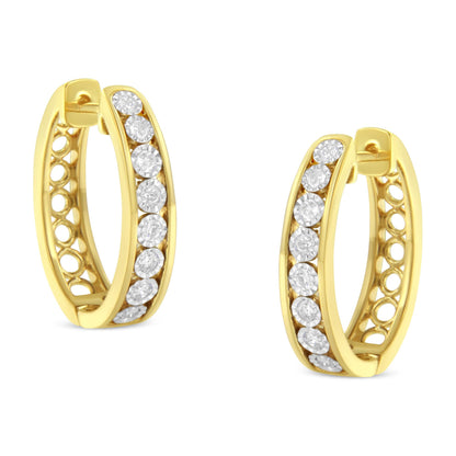 Front angled view of two-toned hoop earrings set with round white gemstones in a miracle setting along the front band.
