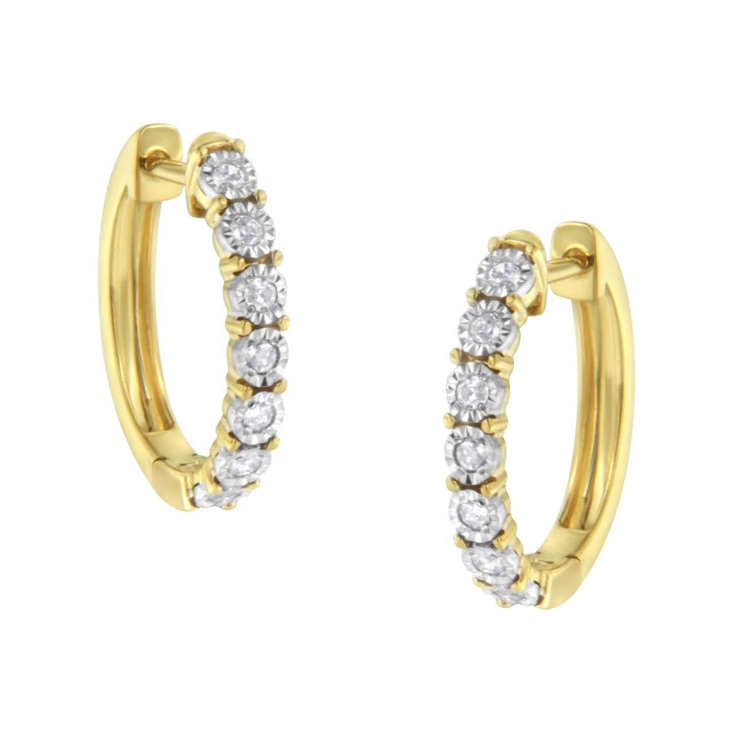 Close-up image of two-toned hoop earrings set with round white gemstones in a continuous row, shown from a slightly angled front view.
