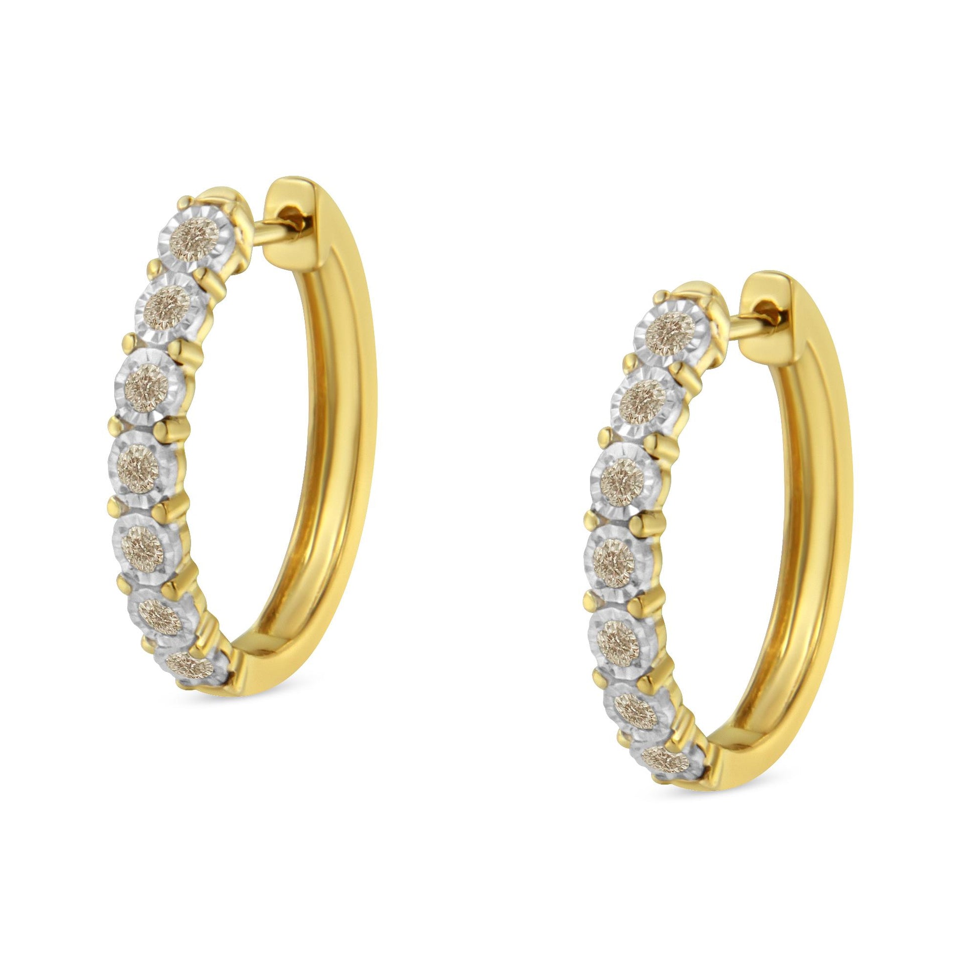 Pair of two-toned hoop earrings with round white gemstones in miracle setting, shown from a front angled view.