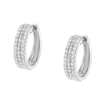 Pair of white metal hoop earrings with multiple rows of pave-set round white gemstones, shown from a front angle.