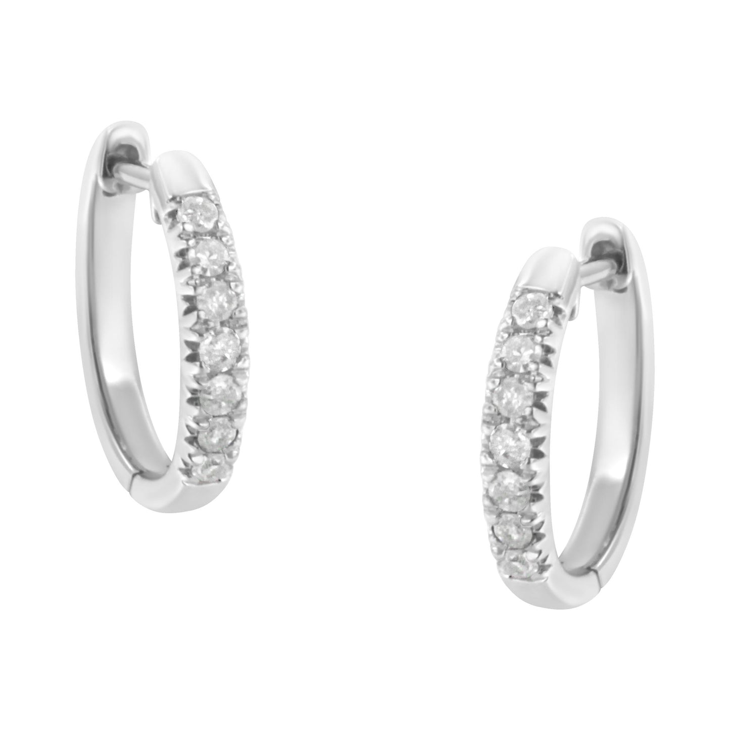 Pair of white metal hoop earrings with round white gemstones in prong settings, front angle view.