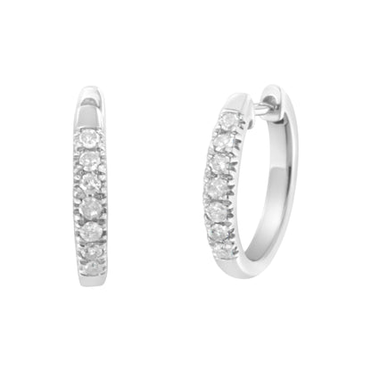 Pair of white metal hoop earrings with white round gemstones in prong settings, shown from front and angled side views.