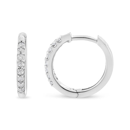 Pair of white metal hoop earrings with round white gemstones in prong settings, shown from front and side angles on a white background.