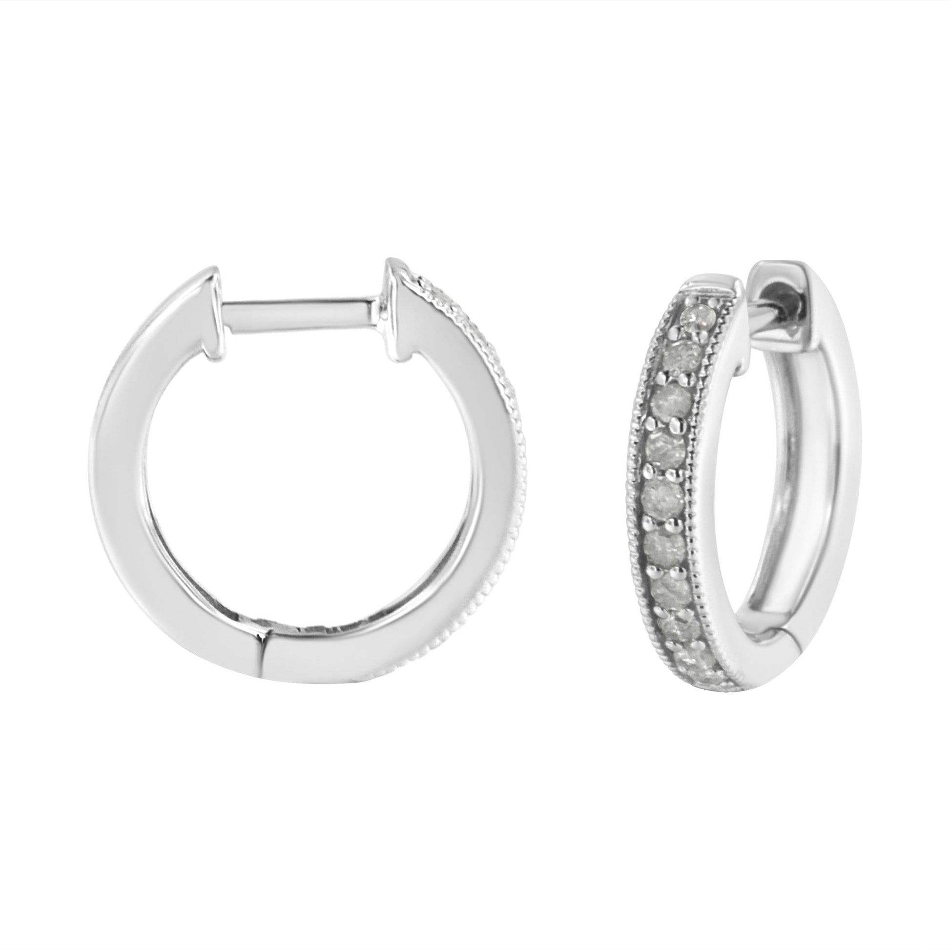 Pair of white metal hoop earrings with round white gemstones in prong setting along outer edge, shown from front and side angles on white background.