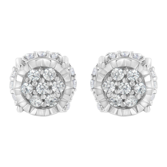 Front angle view of white metal round cluster stud earrings with multiple white gemstones in prong setting.