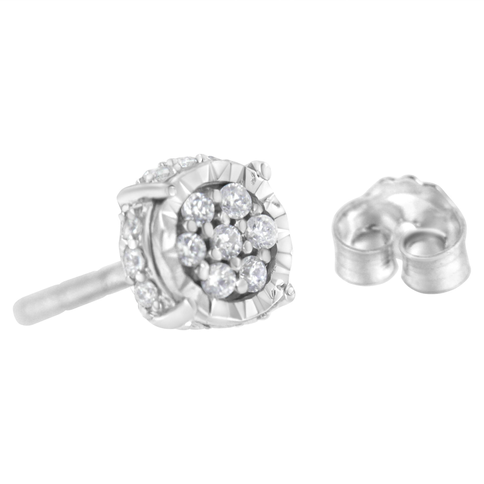 Close-up side angle of a white metal stud earring with round white gemstones in prong settings and a separate metal earring back.