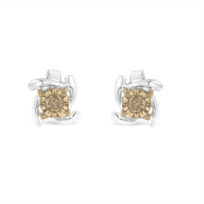 Front-facing view of two-toned stud earrings featuring round champagne-colored gemstones with a twisted metal design surrounding each stone.