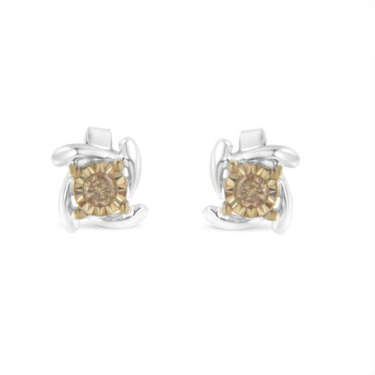 Front-facing view of two-toned stud earrings featuring round champagne-colored gemstones with a twisted metal design surrounding each stone.