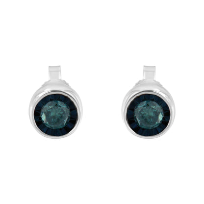 Front view of white metal earrings featuring a central round blue gemstone surrounded by a circle of smaller dark blue gemstones.