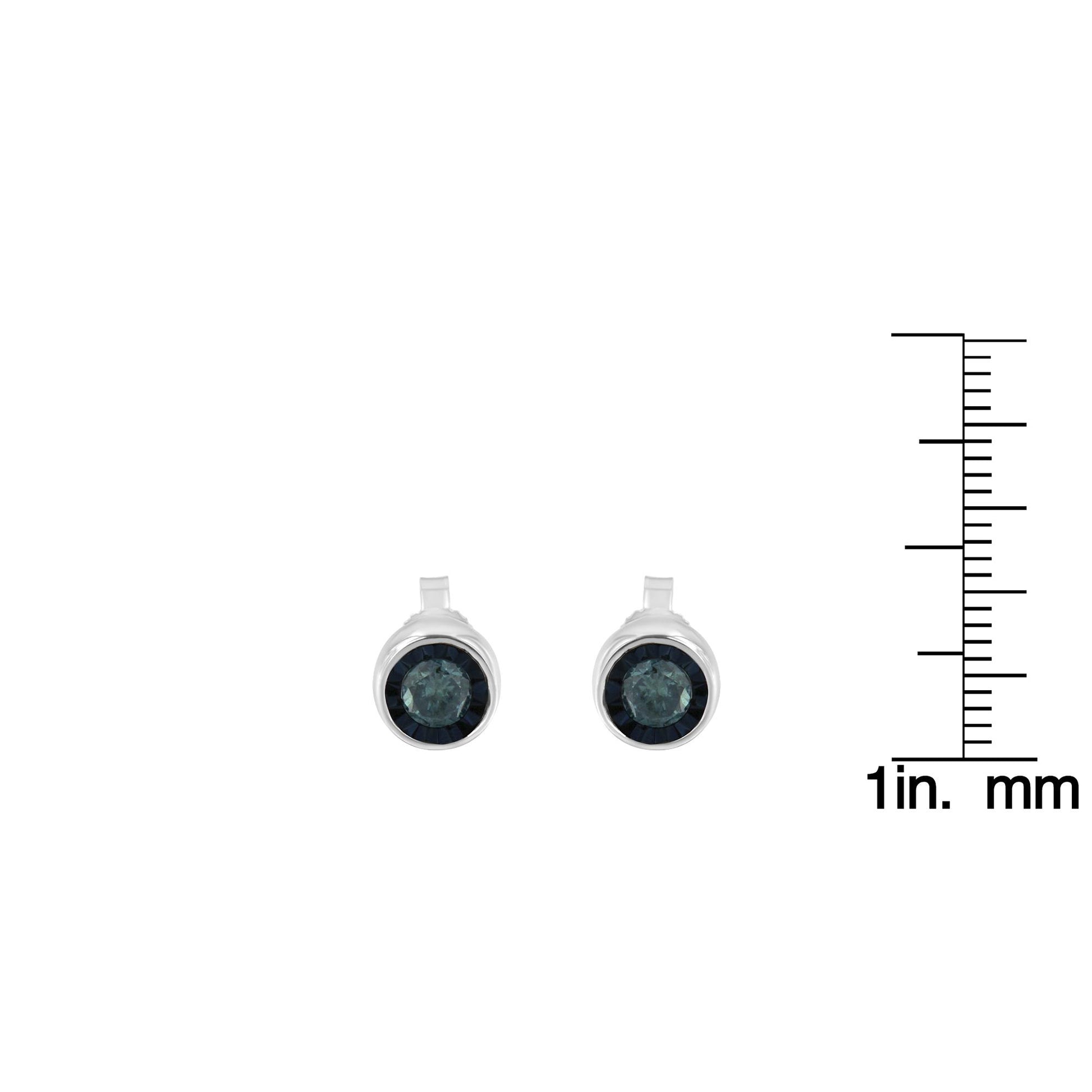 Front view of white metal round stud earrings with blue gemstones, shown next to a ruler for size reference.