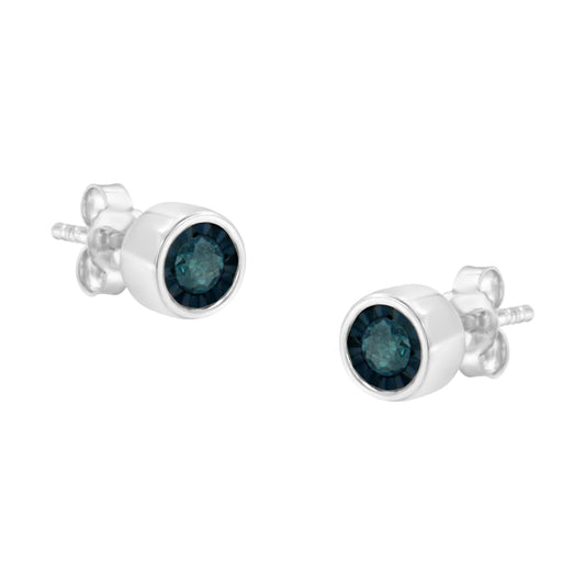Pair of white metal stud earrings with round blue gemstones in miracle settings, front angle.
