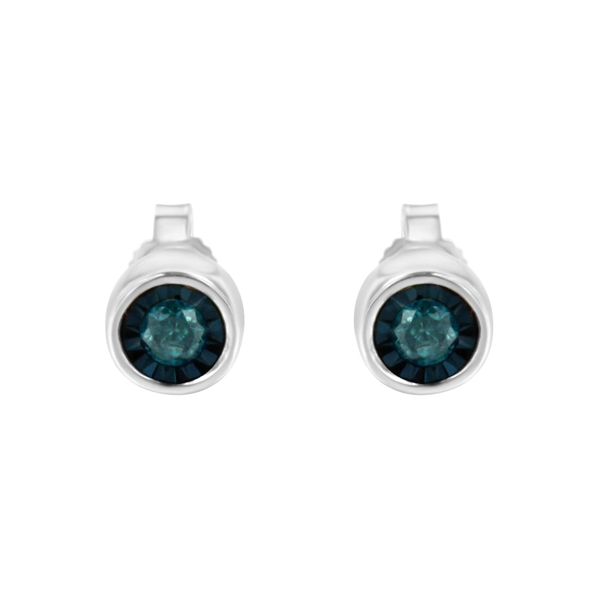 Front view of white metal stud earrings with round blue gemstones set in the center.