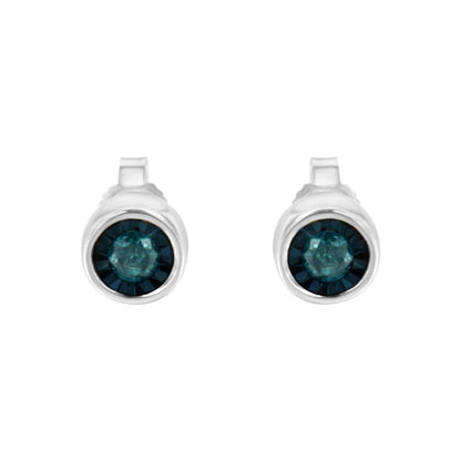 Front view of white metal stud earrings with round blue gemstones set in the center.
