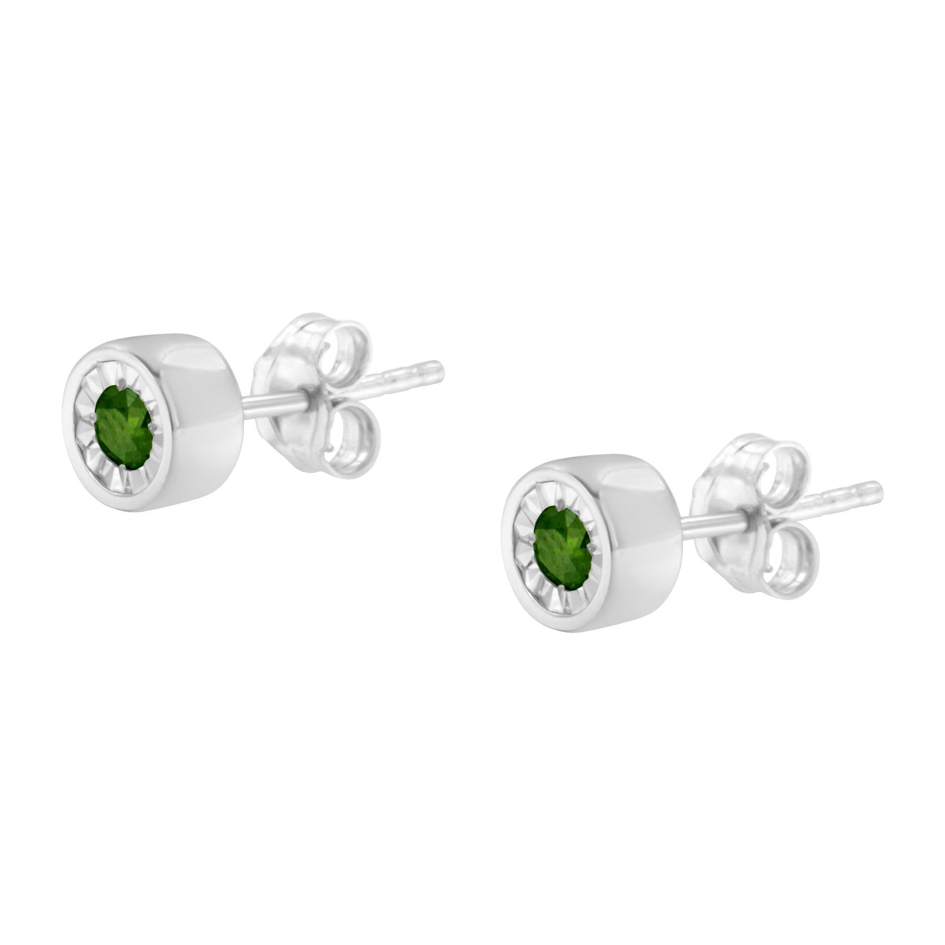 Pair of white metal stud earrings with round green gemstones in miracle settings, shown at an angled side view.
