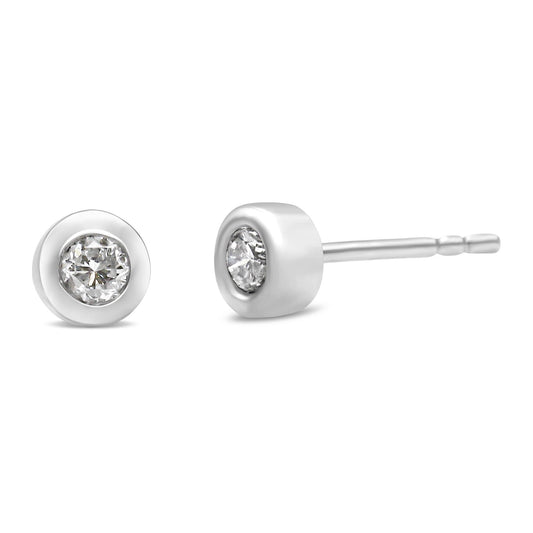 Close-up front and side view of white stud earrings with round white gemstones in bezel settings.