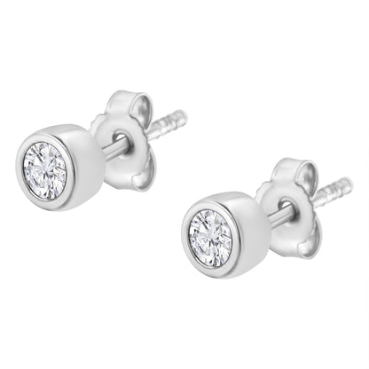 Pair of white metal stud earrings with round white gemstones in bezel settings, shown from a slightly angled front view.