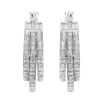 Front view of white metal earrings with three vertical rows of small round white gemstones in pave setting.