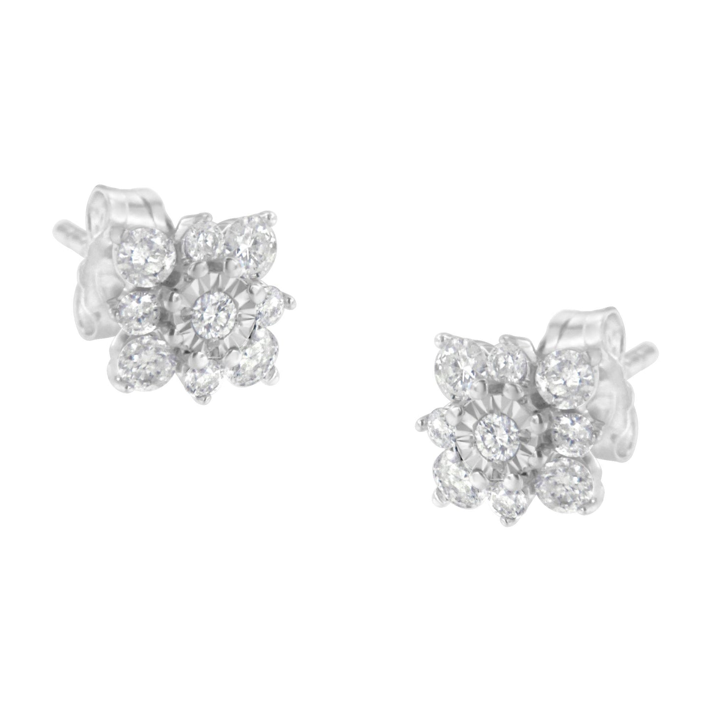 Pair of white metal stud earrings with round white gemstones in prong and miracle settings, shown at a slight angle on a white background.