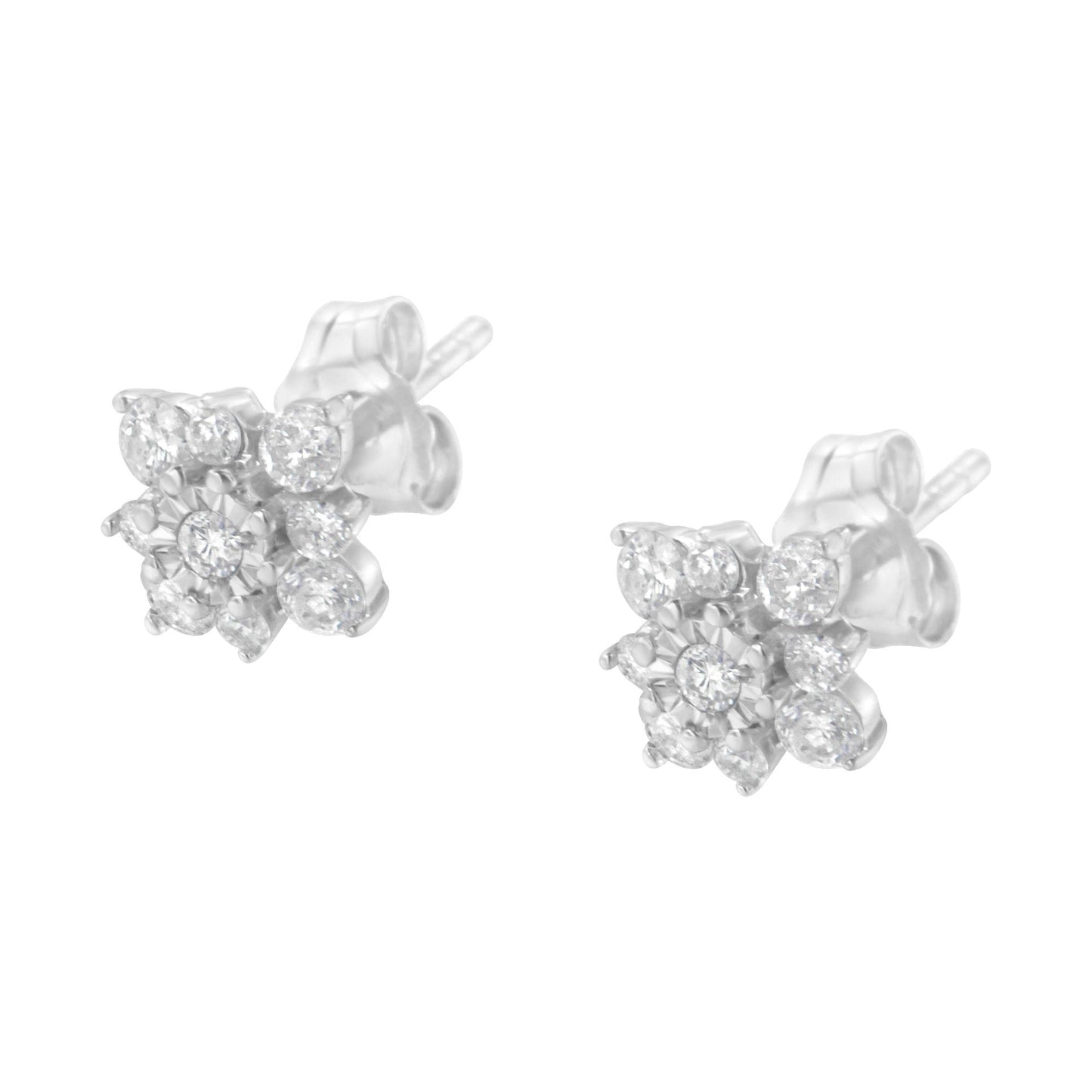 Pair of white metal stud earrings with multiple round white gemstones in prong and miracle settings, shown from a front angle.