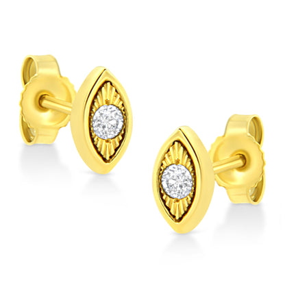 Pair of yellow metal stud earrings shown at an angled front view, featuring marquise-shaped settings with round brownish colored gemstones in the center and detailed textured accents around the stones.