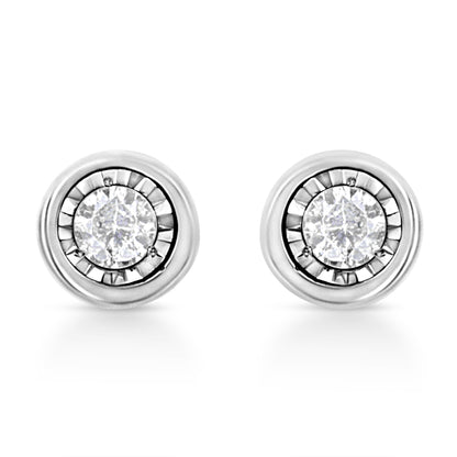 Pair of white stud earrings with round white gemstones in miracle setting, shown from front angle.
