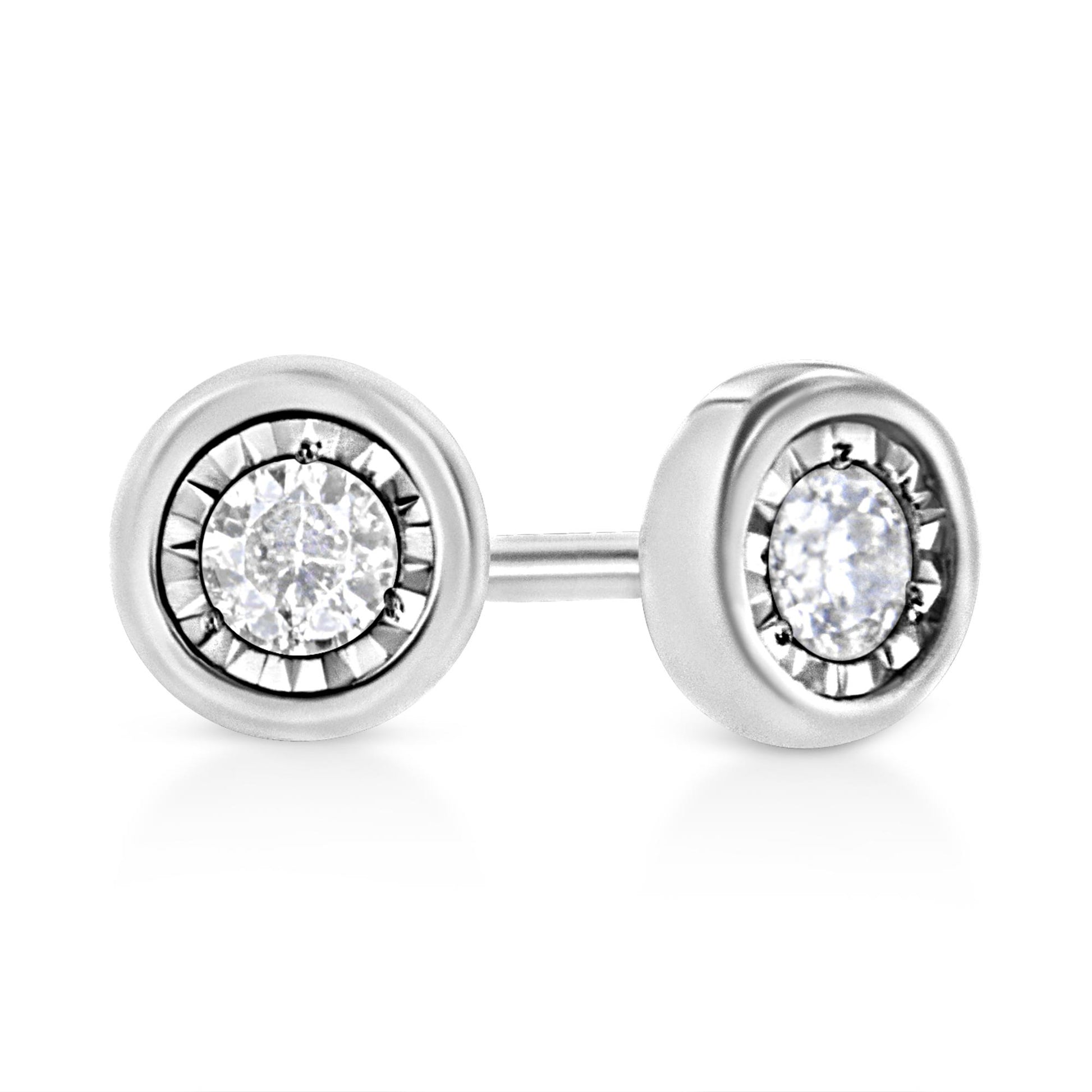 Close-up front angle of white metal stud earrings with round white gemstones in a miracle setting.