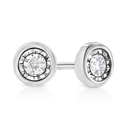 Close-up front angle of white metal stud earrings with round white gemstones in a miracle setting.