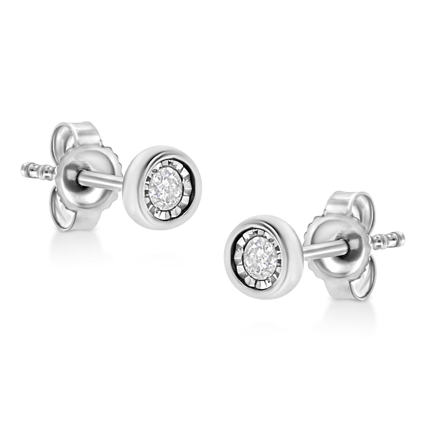 Pair of white metal stud earrings with round white gemstones in miracle settings, shown at an angle.