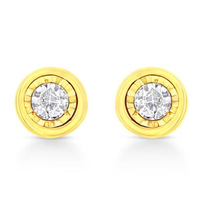 Front angle view of a pair of round yellow metal stud earrings with two brownish round gemstones in miracle settings.