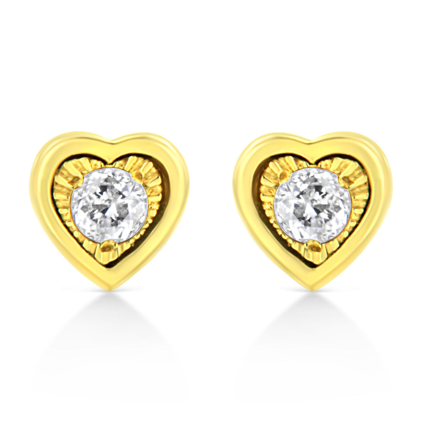 Front-facing shot of yellow metal heart-shaped earrings each set with a round white gemstone in a miracle setting with brownish accents.