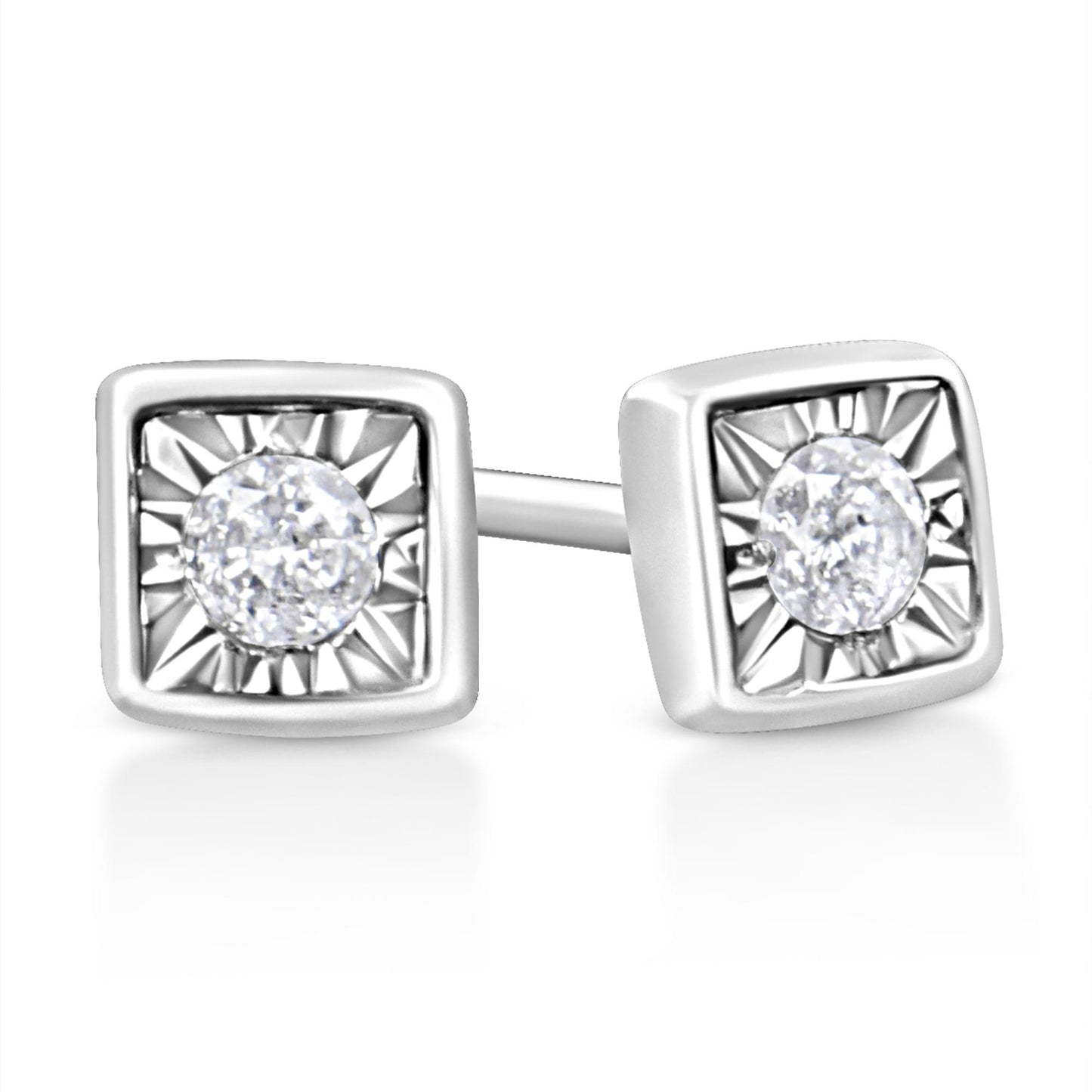 Close-up front angle of white stud earrings with square settings and round white gemstones in the center.