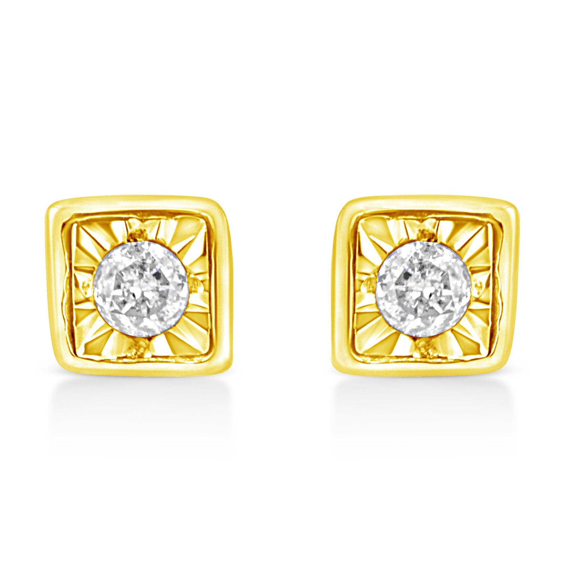 Front view of a pair of yellow metal square earrings with a round white gemstone in the center with a radiant pattern around it.