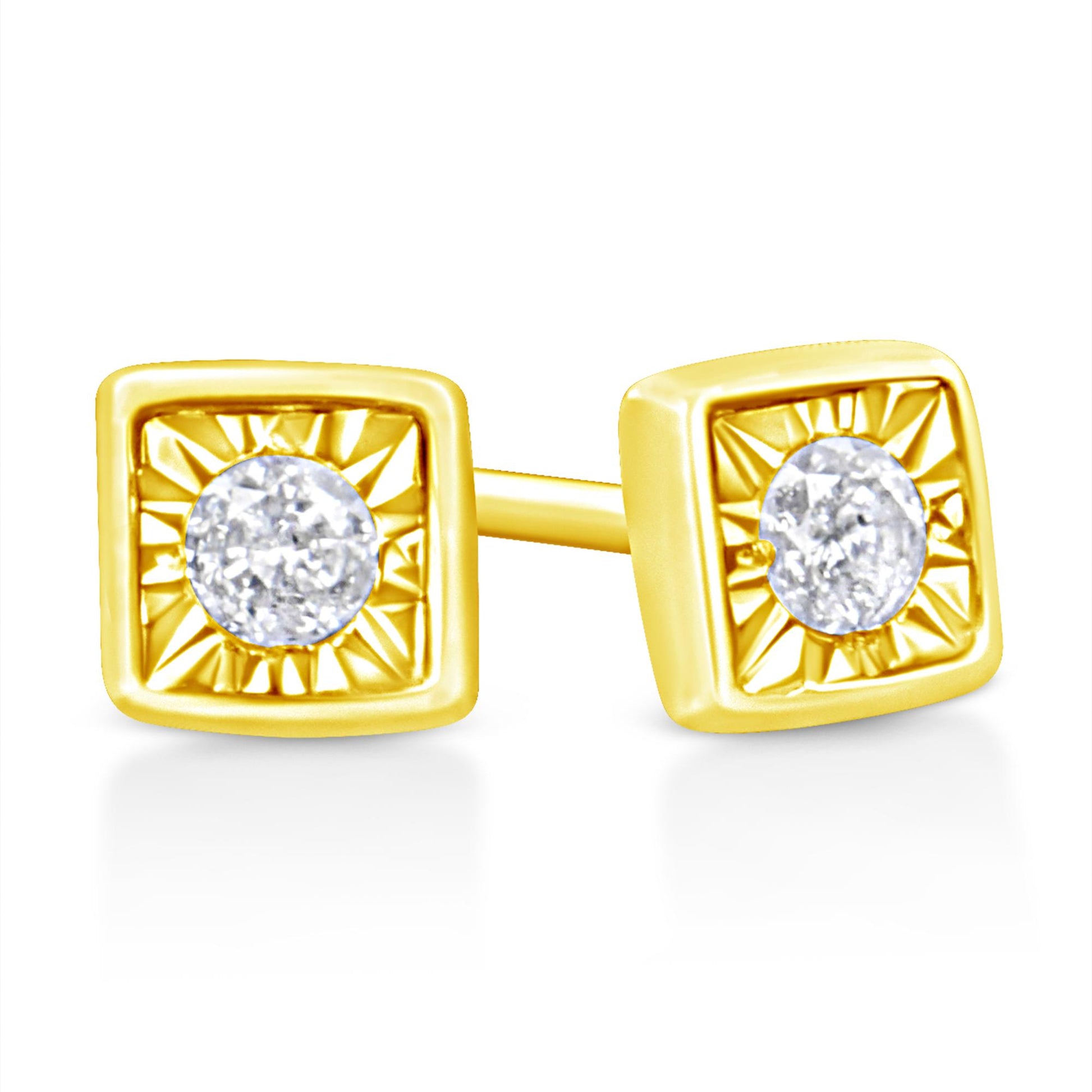 Close-up front angle of yellow metal square-shaped earrings each featuring a round white gemstone in a miracle setting.
