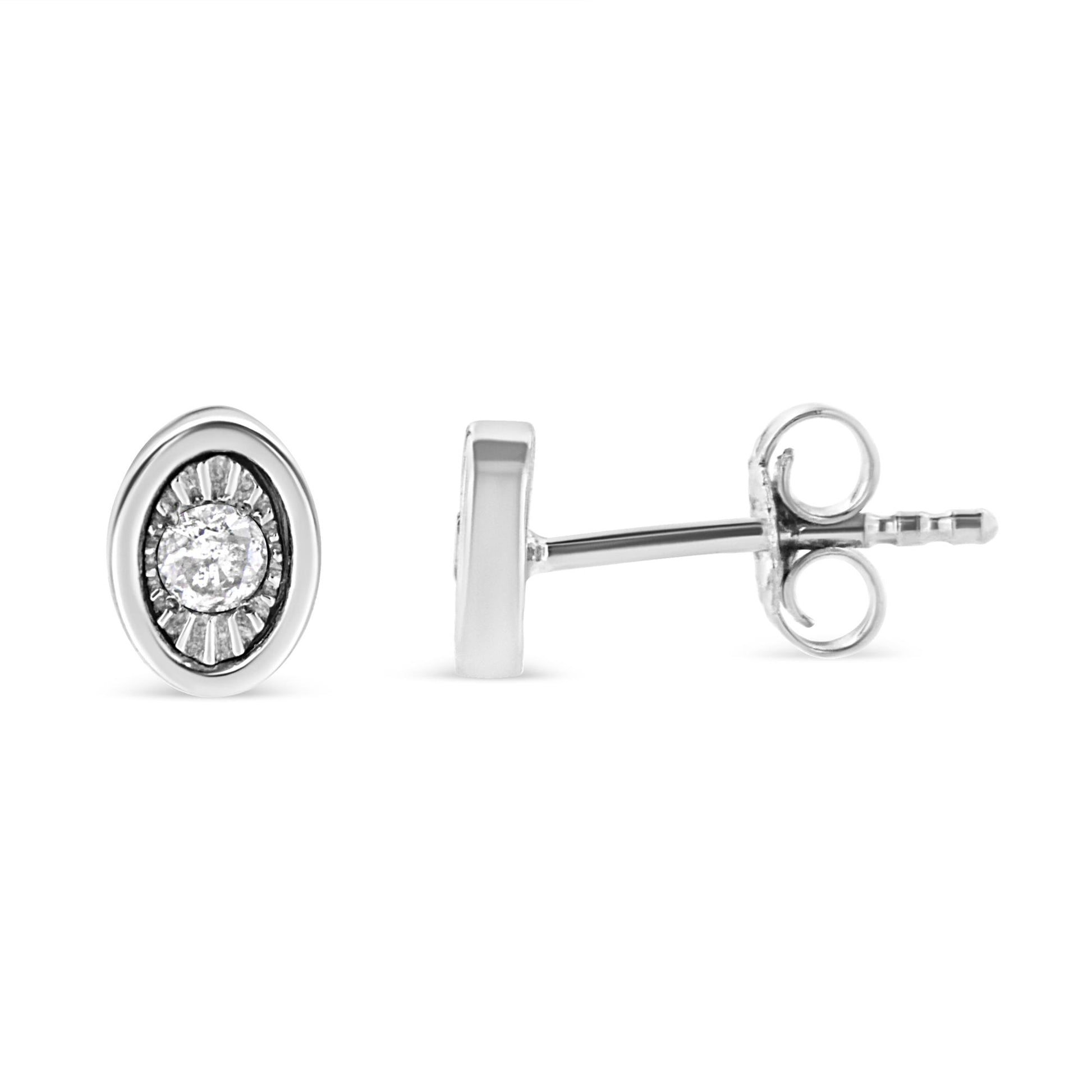 Front and side view of a white metal oval stud earring with a round white gemstone in the center in miracle setting on a white background.