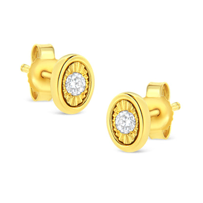 Pair of yellow metal stud earrings with round white gemstones set in a miracle setting, shown at a slight angle.
