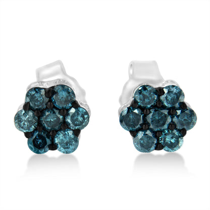 Front-facing close-up of white metal earrings with round blue gemstones in a cluster design.